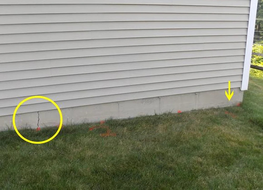 A foundation wall with a highlighted crack